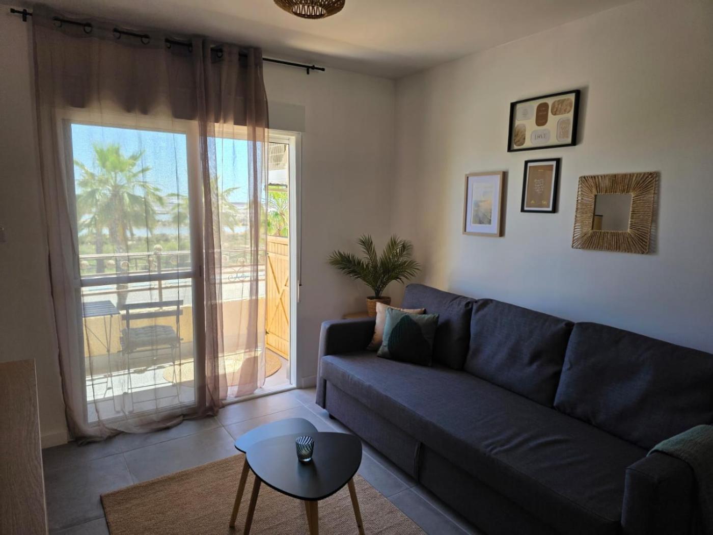Brisa Marina Apartment living room opening to the balcony